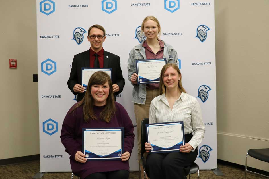 Lowry Scholars for 2022-2023: Justice Forster (back left), Elsie Aslesen; Brenna Byer (front left), Grace Schofield.