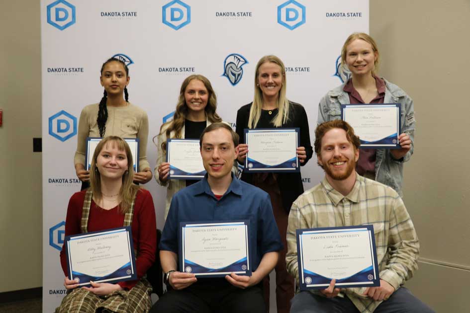Kappa Sigma Iota members honored included: Christina Mulu (back left), Kayla Gerken, Morgan Erikson, Elsie Aslesen; Abby Maloney (front left), Ryan Morganti, Luke Kremer.